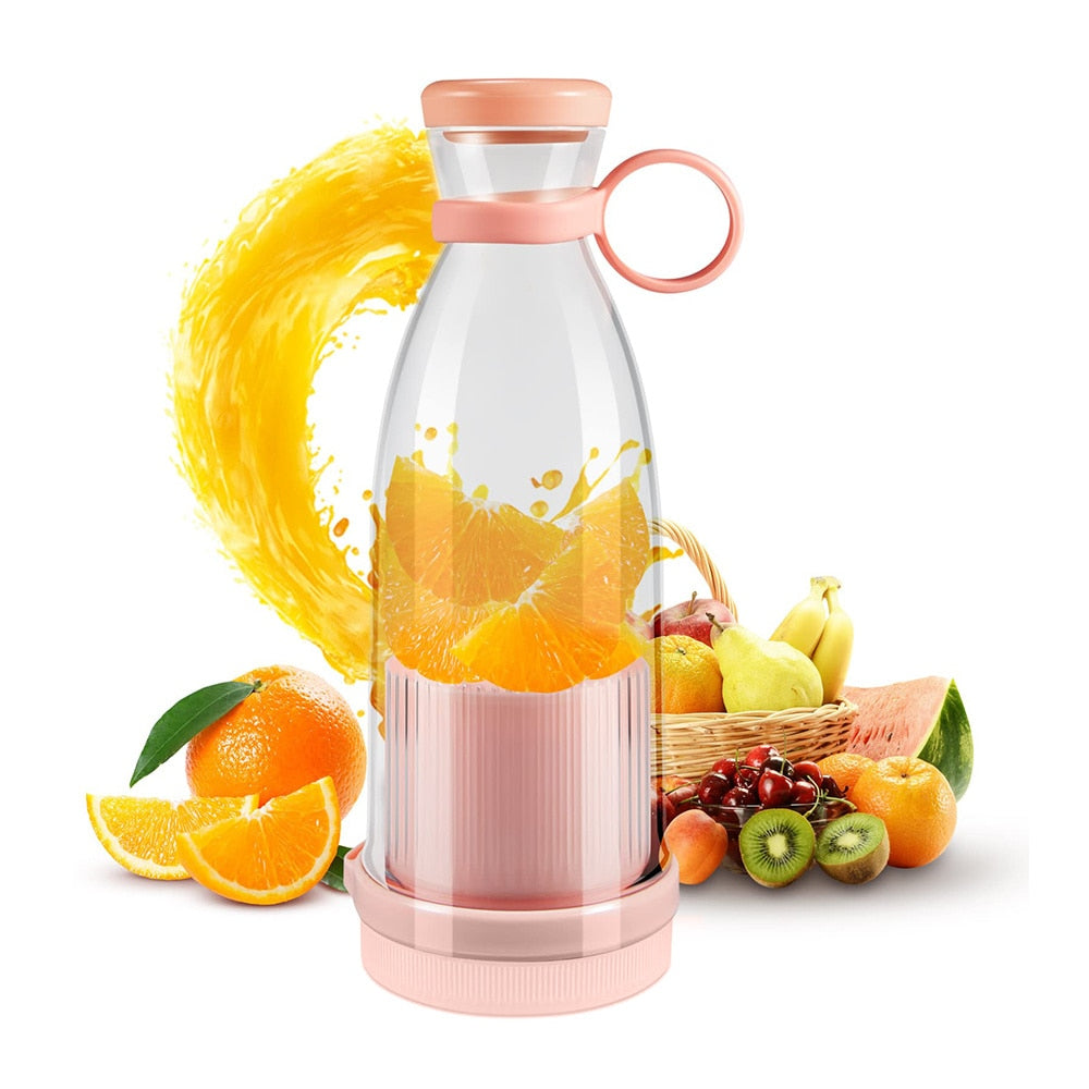 Pink Mini Portable Smoothie Blender next to a basket of fruit and blending up orange juice