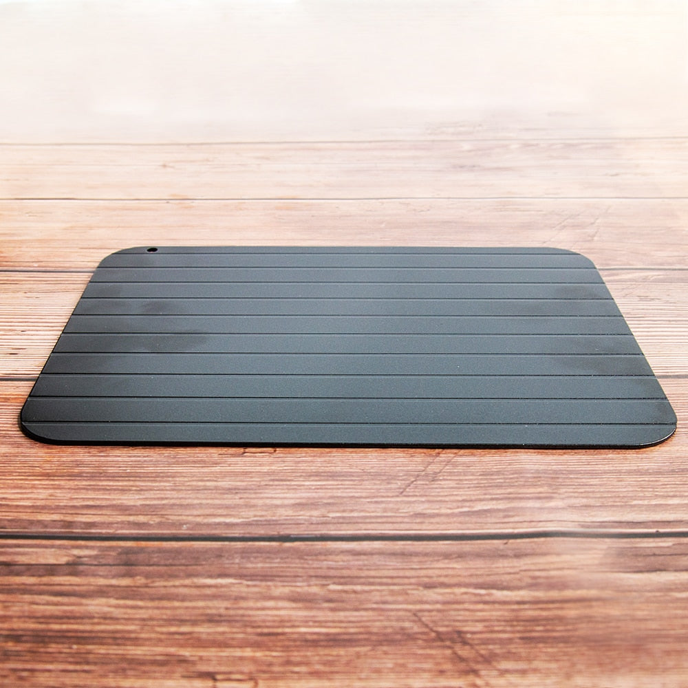 The Fast Defrosting Plate Board resting on a bench-top